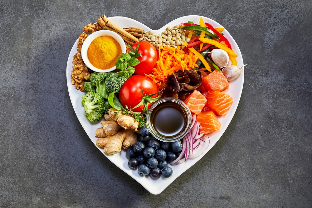 heart shaped bowl full of healthy food