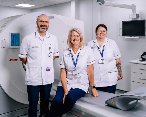 people smiling with mri scanner