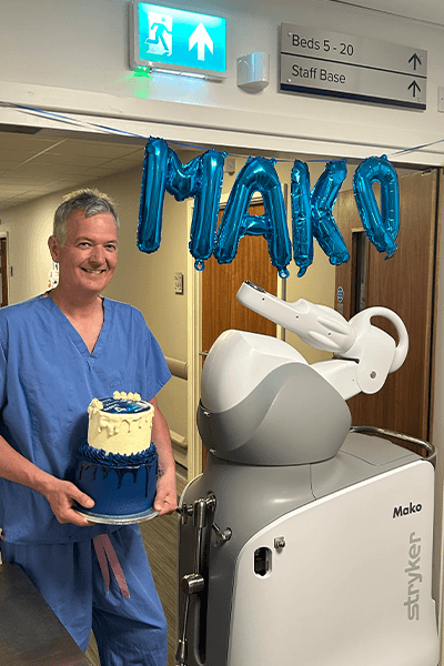 consultant smiling with cake