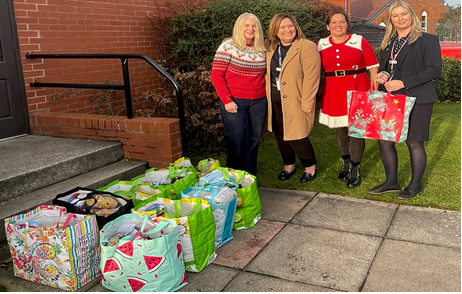 renacres staff members donating gifts