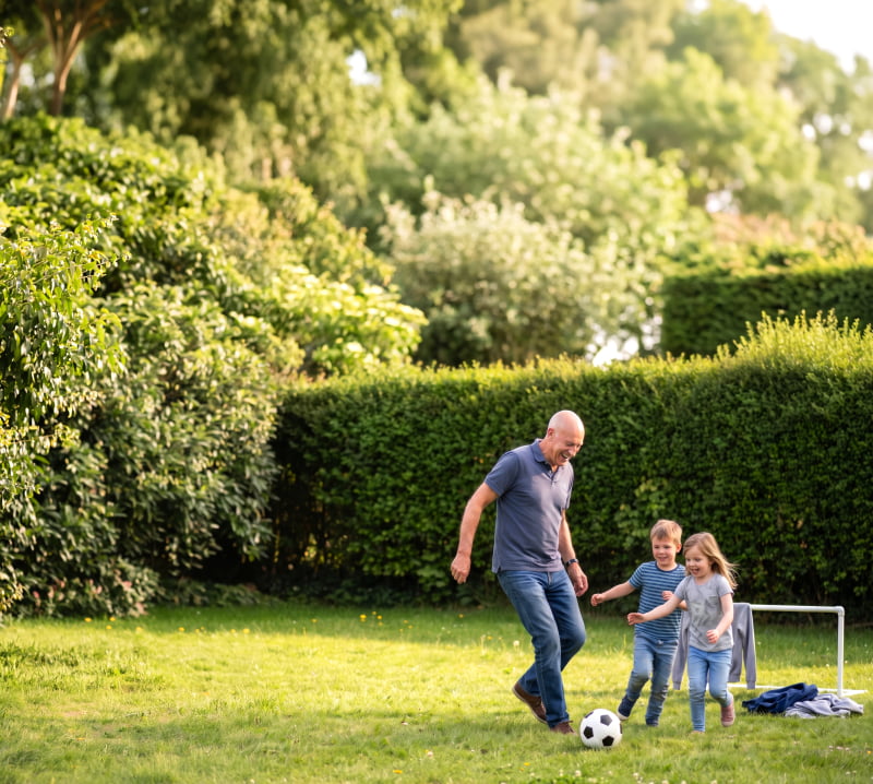 Grandad Playing Football with Kids
