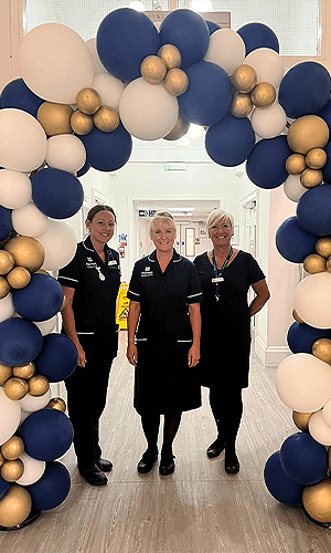 three healthcare workers smiling